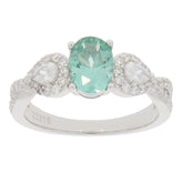 Oval green Moissanite ring in sterling silver, featuring sparkling accent stones, perfect for elegant style.